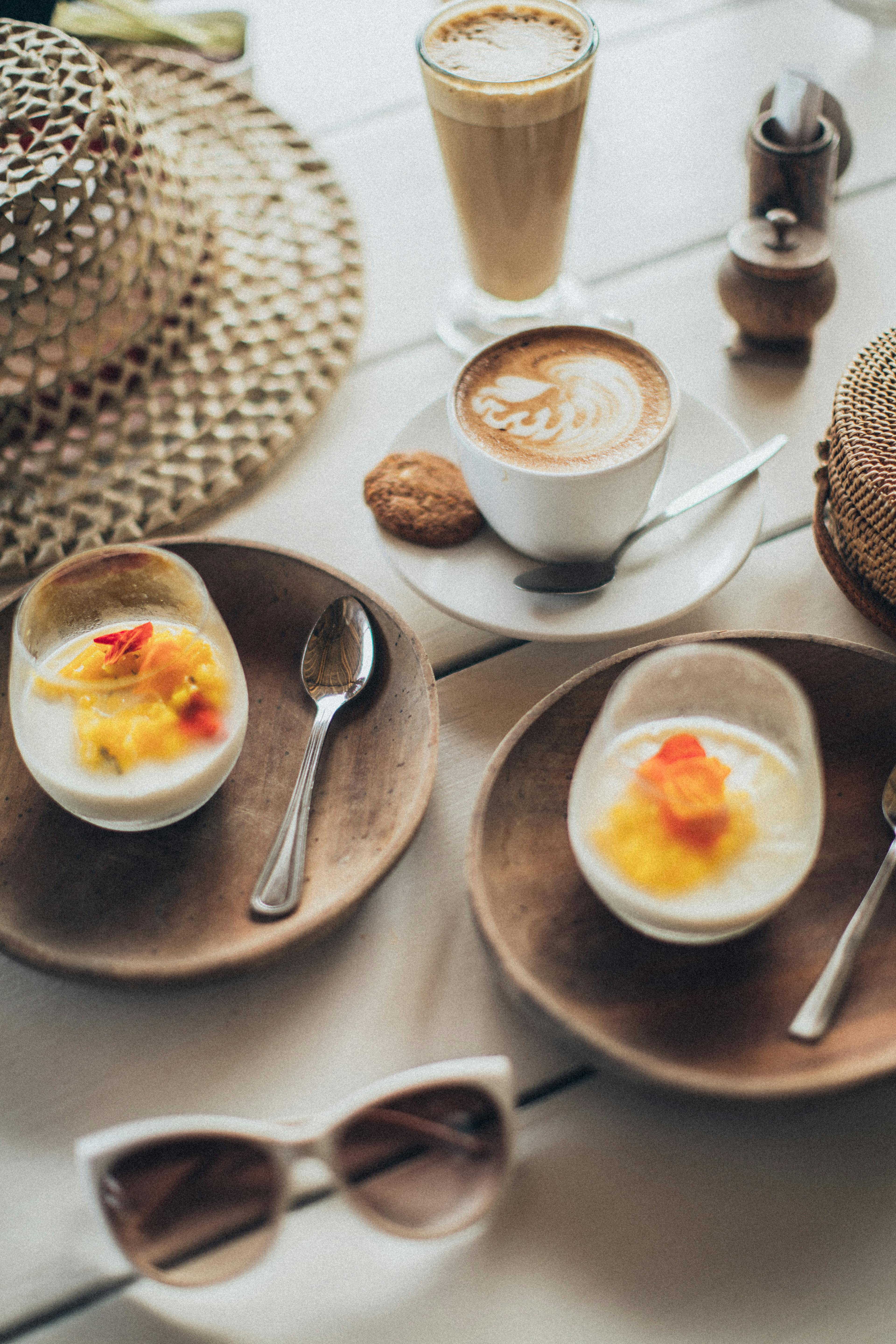 latte near two desserts in glasses