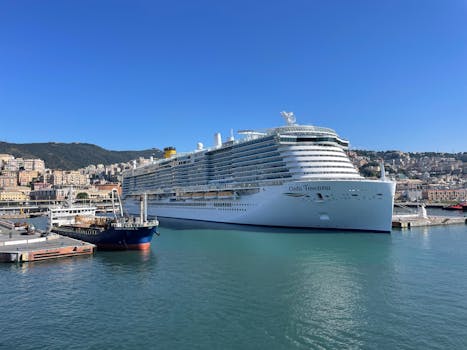 A luxurious cruise ship docked at a scenic coastal harbor on a sunny day, perfect for relaxation and travel enthusiasts.