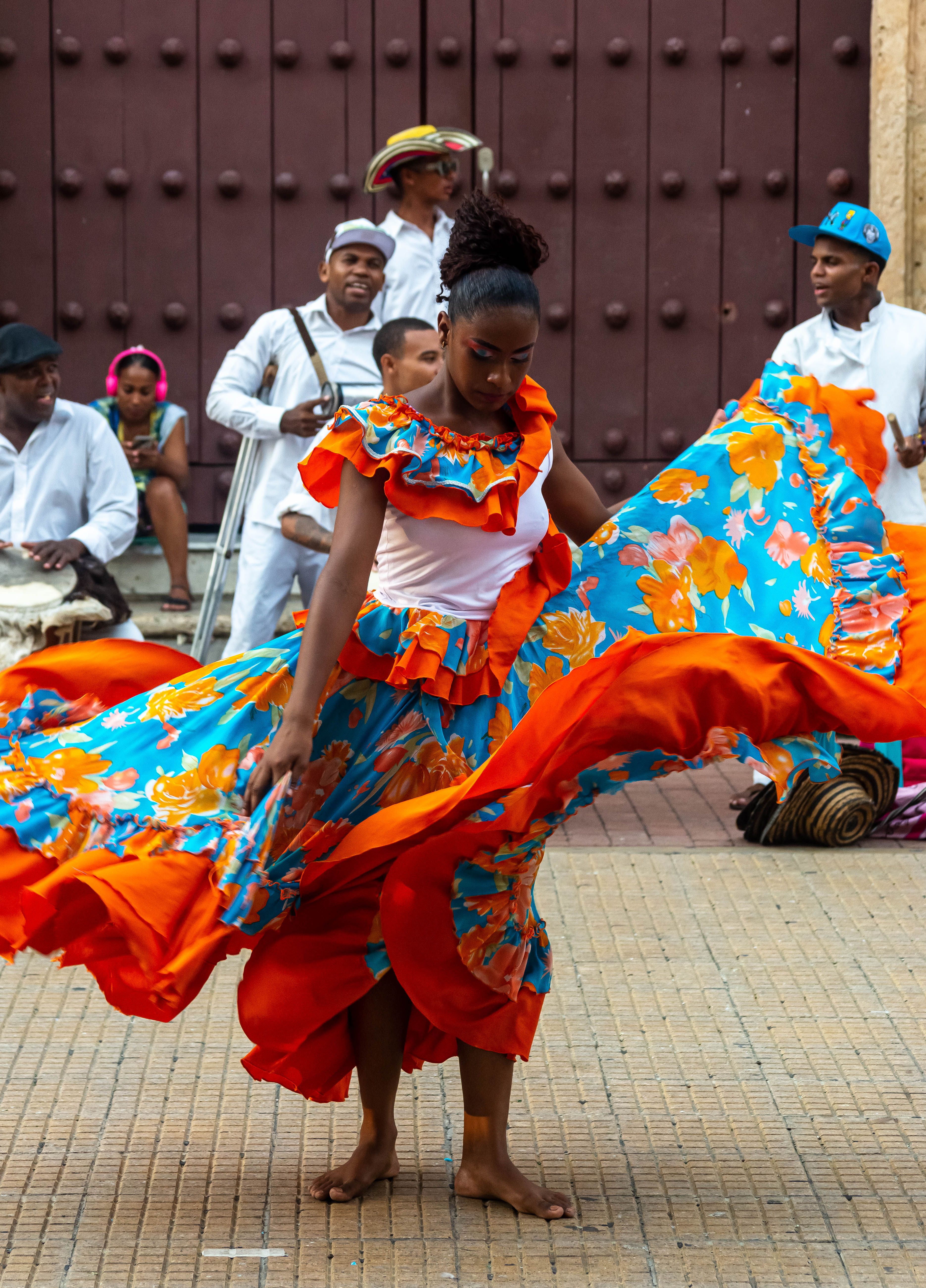 Smiling Women Dancing in Traditional Clothing · Free Stock Photo