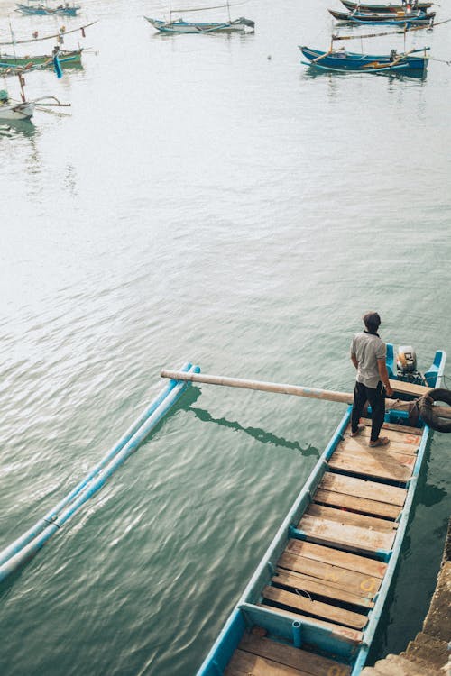 Man Standing On Boat 