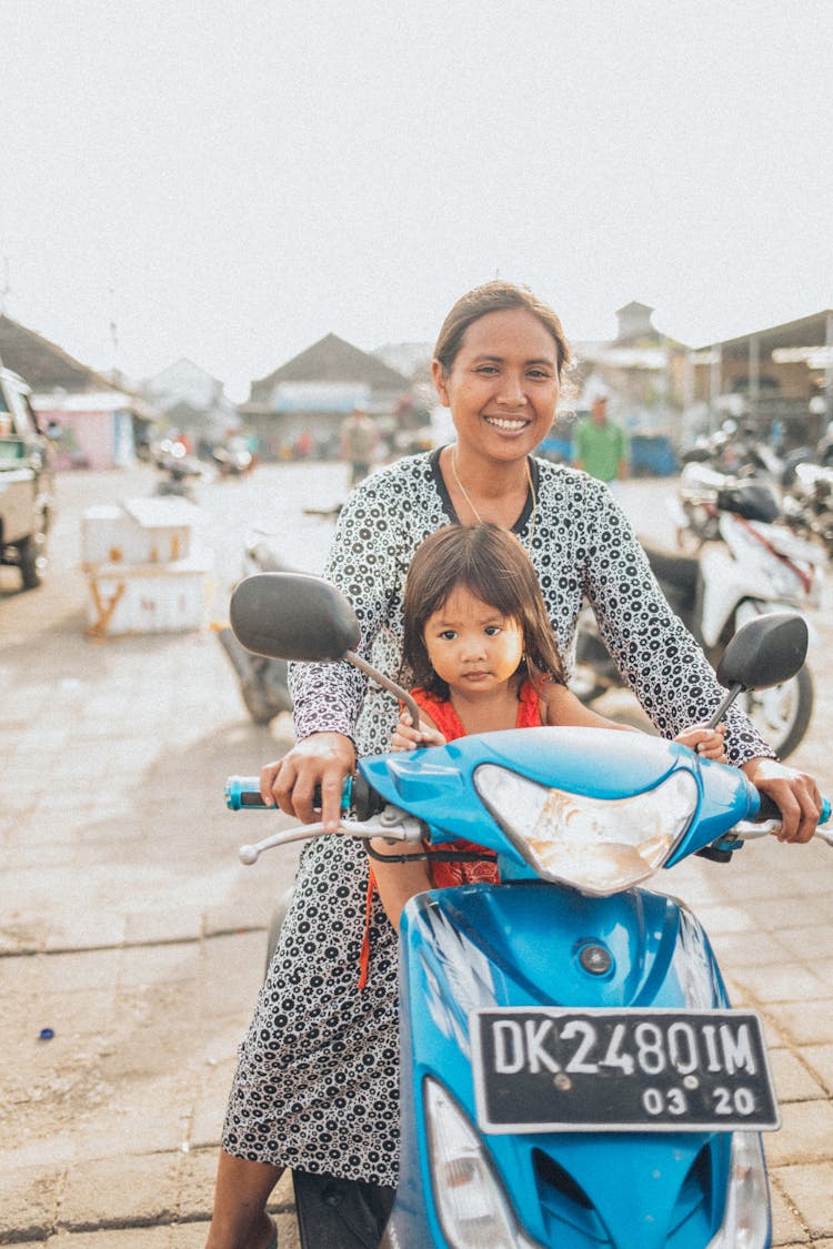 Woman Riding Motor Scooter