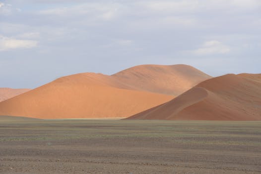 Breathtaking view of the orange sand dunes in the Naukluft region of Namibia.