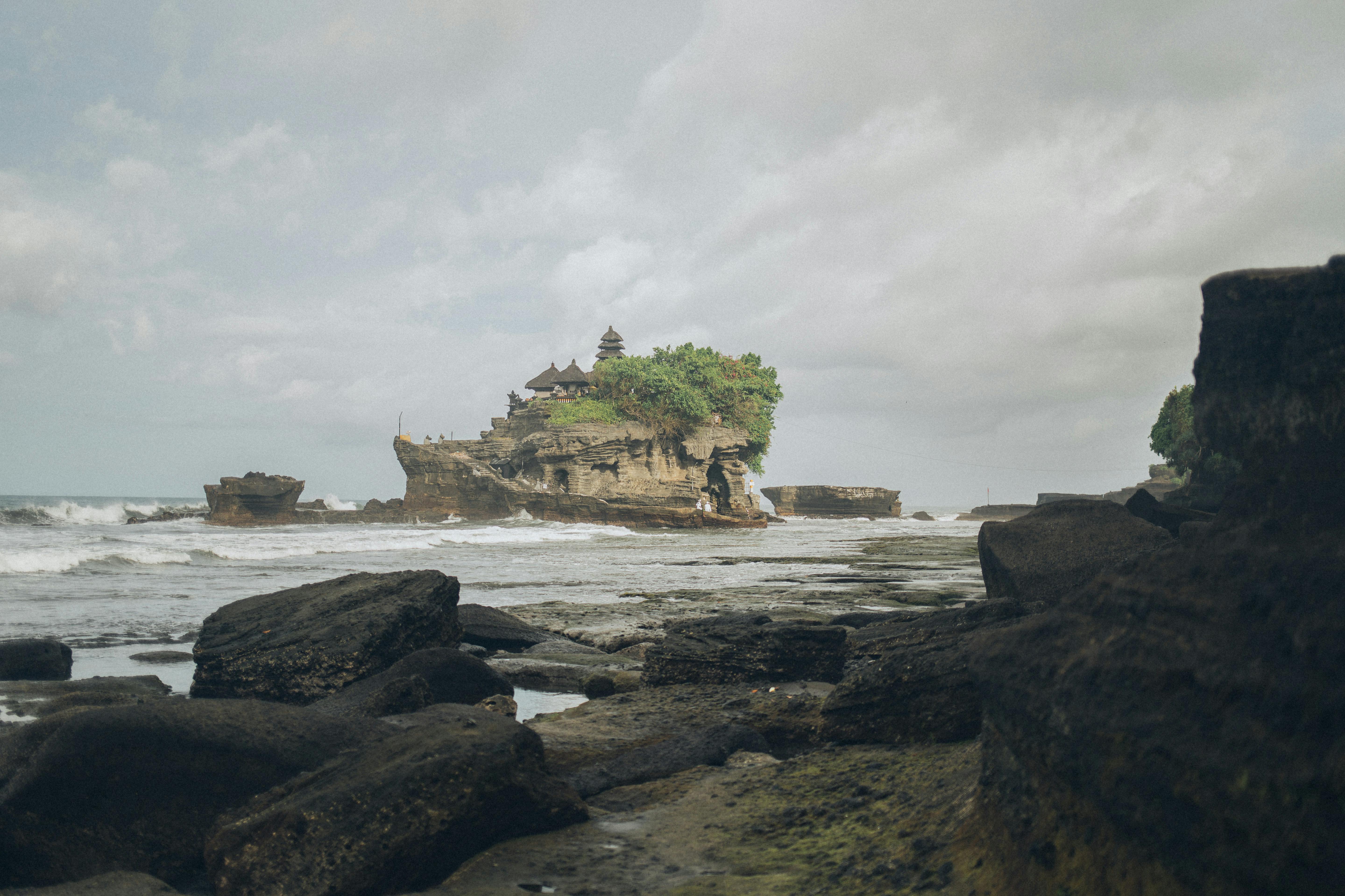 Free Captivating seascape of Tanah Lot Temple on a rocky island in Bali, Indonesia. Stock Photo