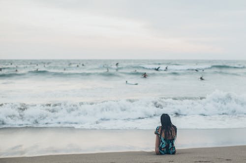 Woman Sitting at Shore