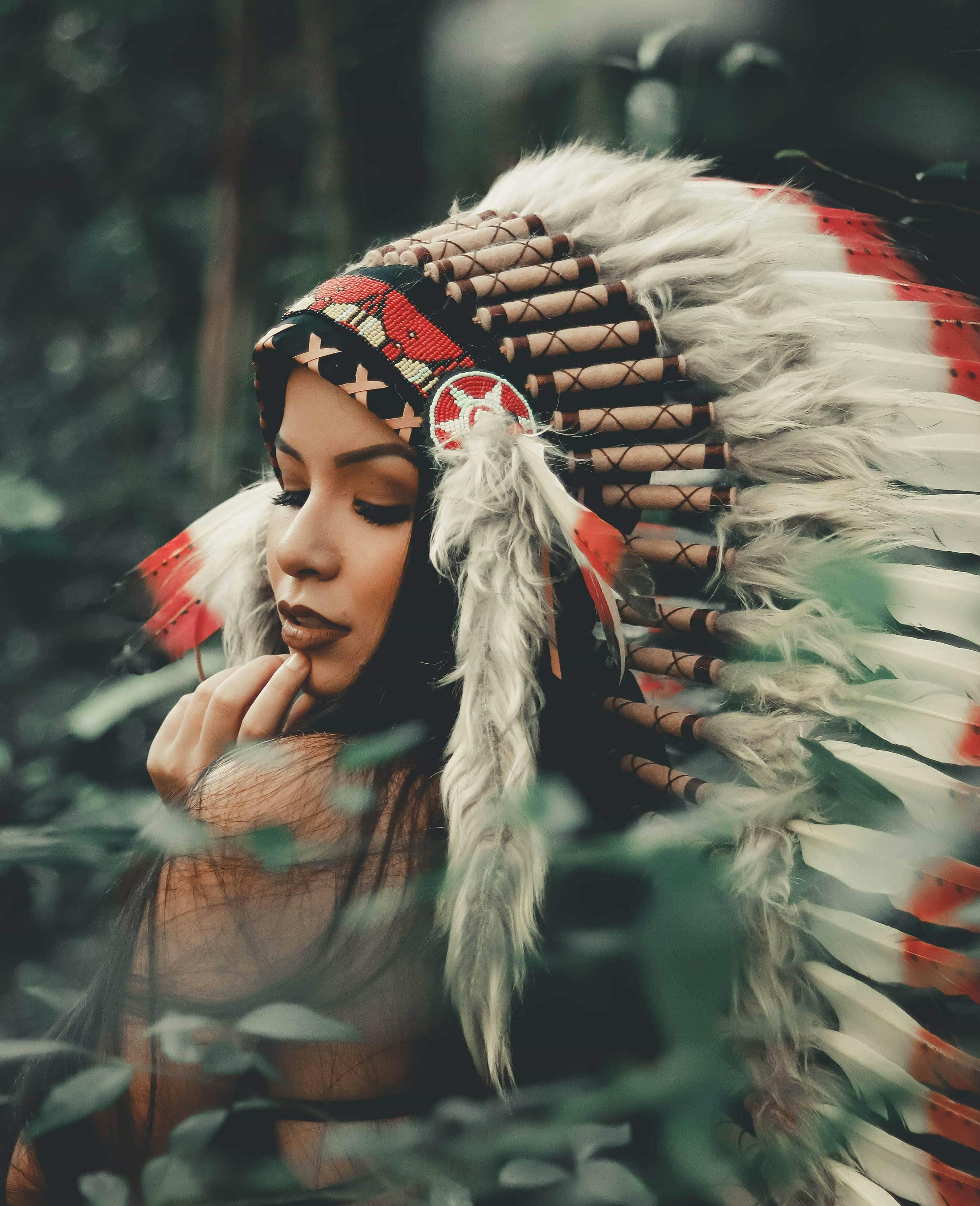 Selective Focus Photography Of Woman Wearing Native American Headdress   Pexels Photo 1838629 