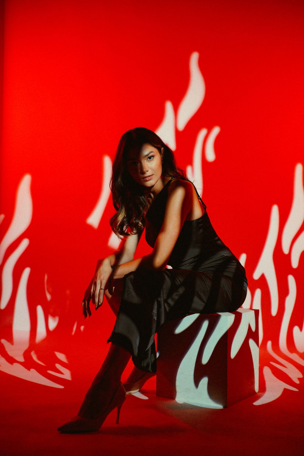 Fashion portrait against a creative red backdrop