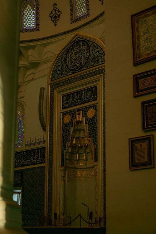 Free Beautiful Ottoman architectural details inside a mosque with ornate patterns and calligraphy. Stock Photo