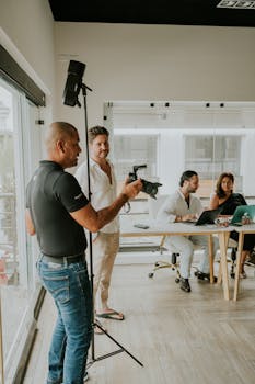 Business team collaborating during a professional indoor photoshoot session.