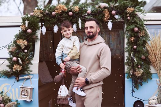 Smiling Father Holding Son