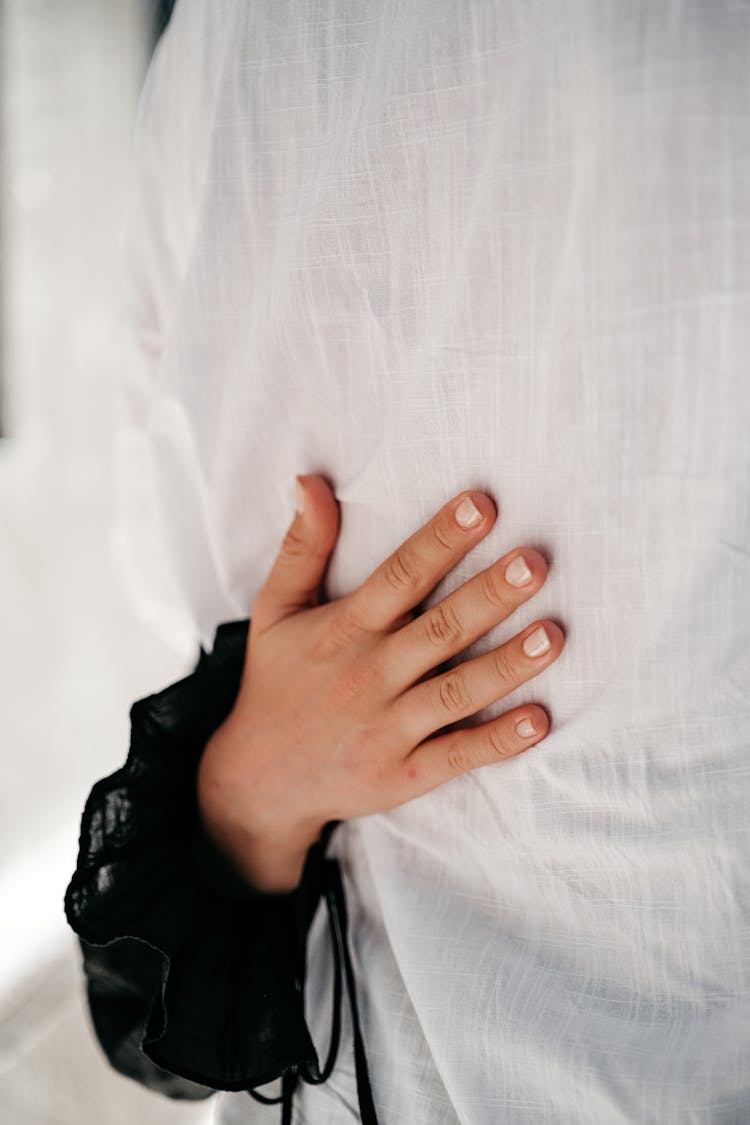 Woman Hand Hugging Man Back