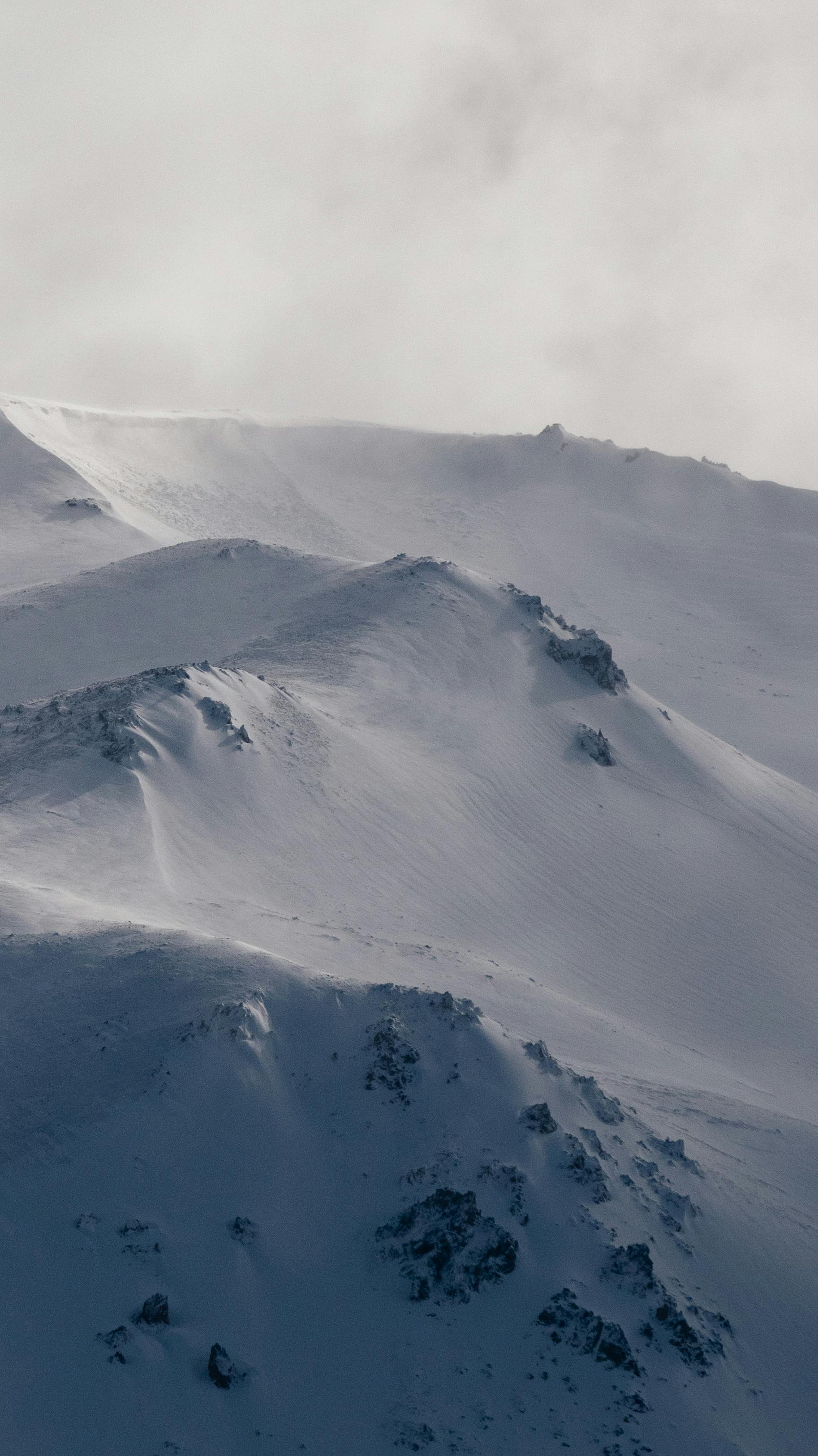 Majestic snow-covered mountain peaks at Esquel, capturing the serene winter landscape.
