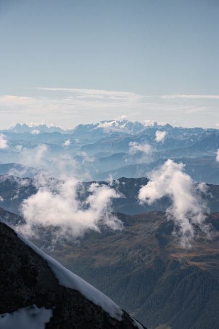 Breathtaking panorama of Ahrntal mountains under cloudy skies, perfect for nature lovers.