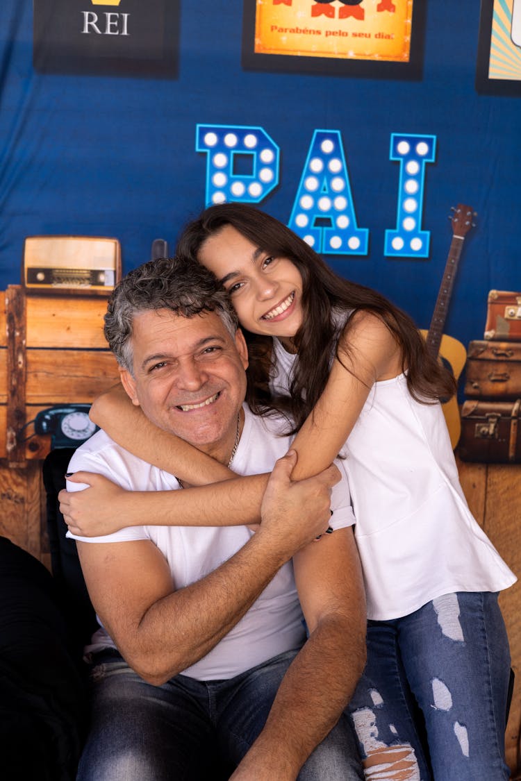 Portrait Of A Girl Embracing Her Father