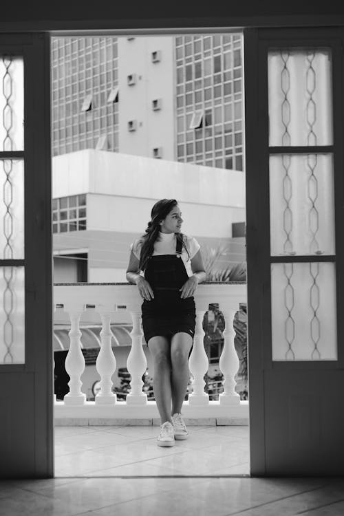 Woman Posing behind Doorway in Black and White