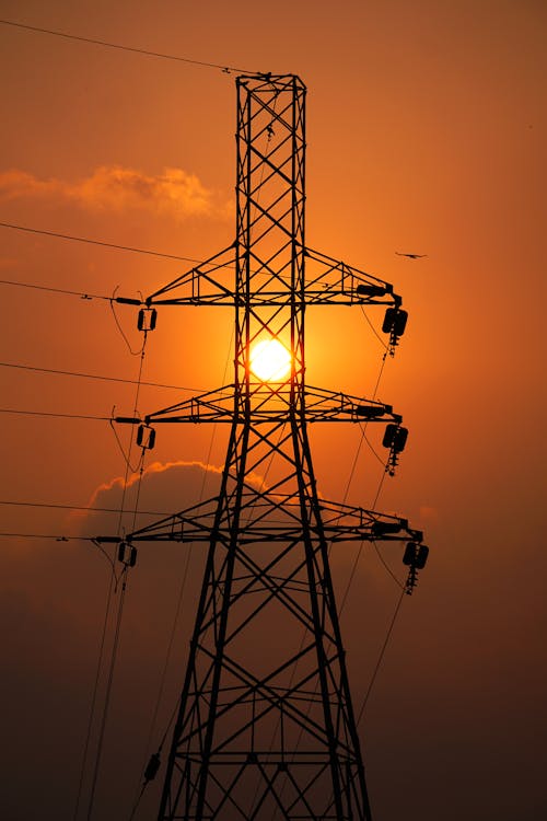 Foto profissional grátis de eletricidade, luz do sol, pôr do sol