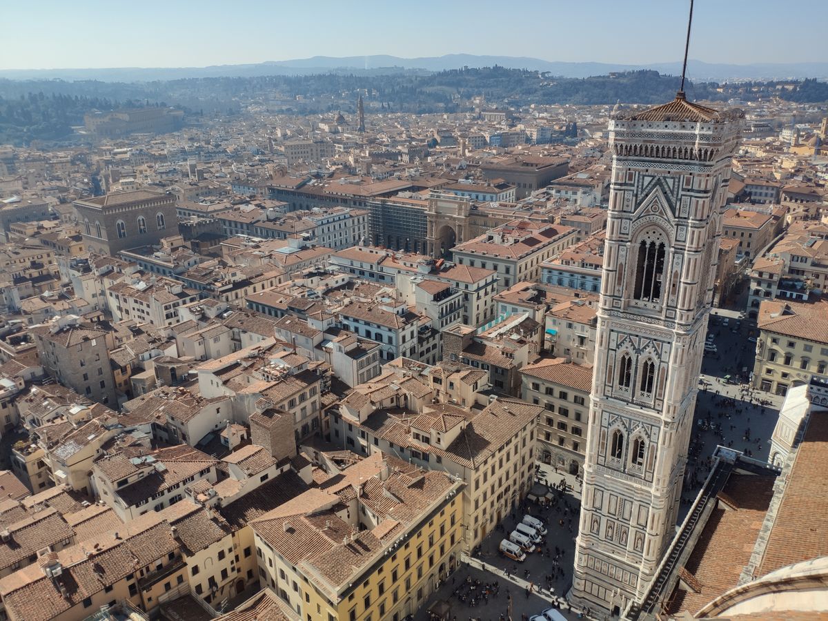 Giotto bell tower campanile Florence with white green pink marble Gothic Tuscan architecture beside Duomo