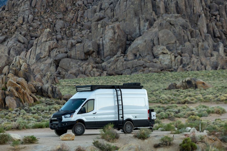 Ford Transit And Rocks Behind