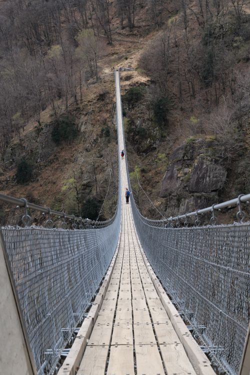 Free A breathtaking view of a suspension footbridge in Bellinzona, Switzerland. Stock Photo