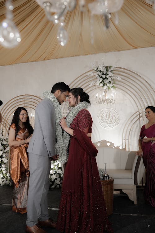 Newlyweds with Garlands on Wedding Ceremony