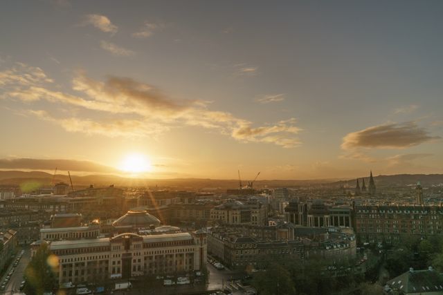 Edinburgh skyline glowing at sunset over the rooftops of the old town
