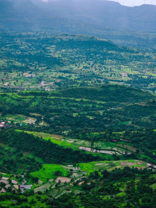 Free Breathtaking aerial view of Nashik's verdant countryside showcasing vibrant green fields and natural beauty. Stock Photo
