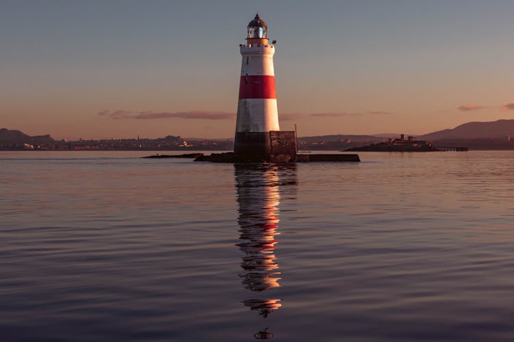 Lighthouse At Sunset