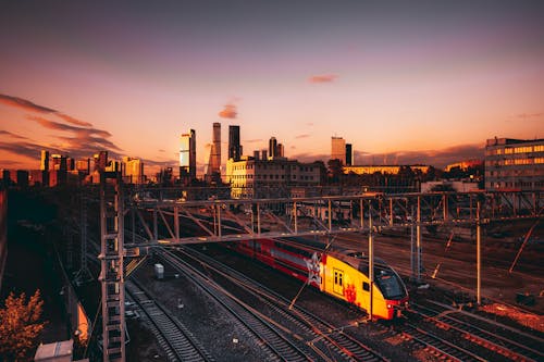 A Train on the Railway and Skyscrapers in a Modern City