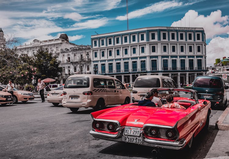 Retro Car Among Traffic On Street