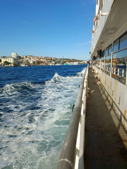 Free Experience the vibrant blue waters on a ferry ride along the Beşiktaş coast in Istanbul. Stock Photo