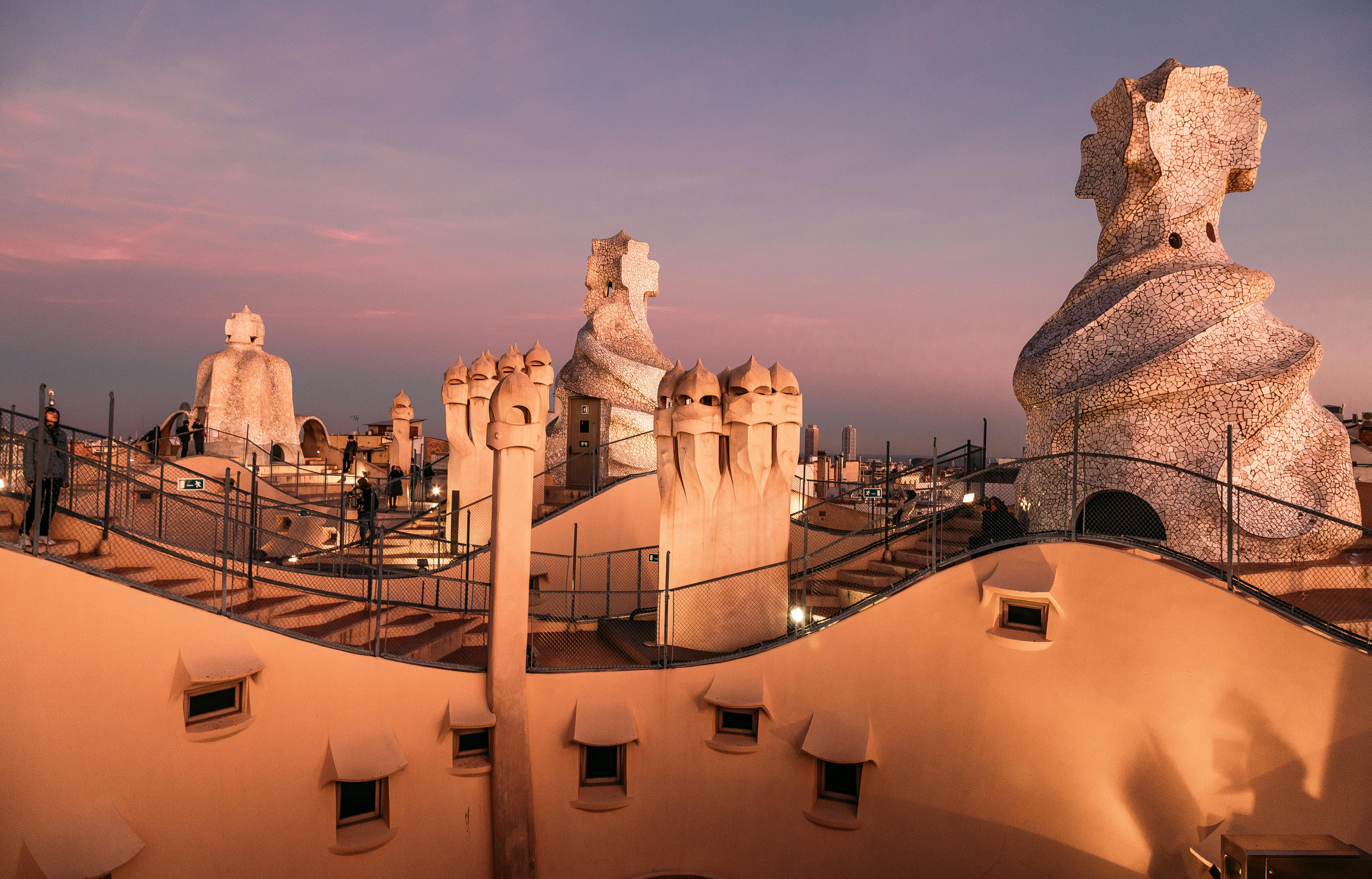 people on the roof of casa mila in barcelona