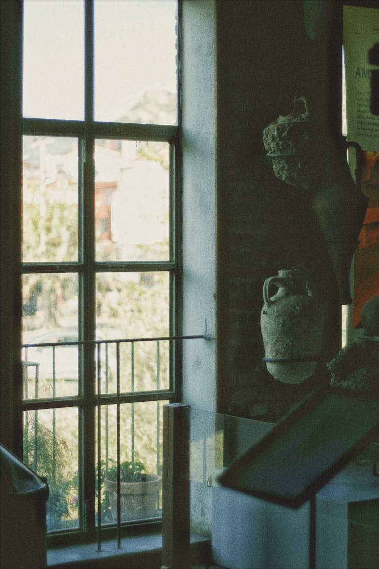 A Window And Antique Artifacts At The Museum