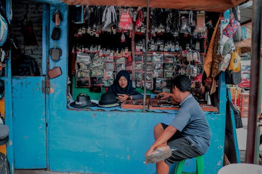 A vibrant traditional market stall in Indonesia showcasing local goods and interactions.