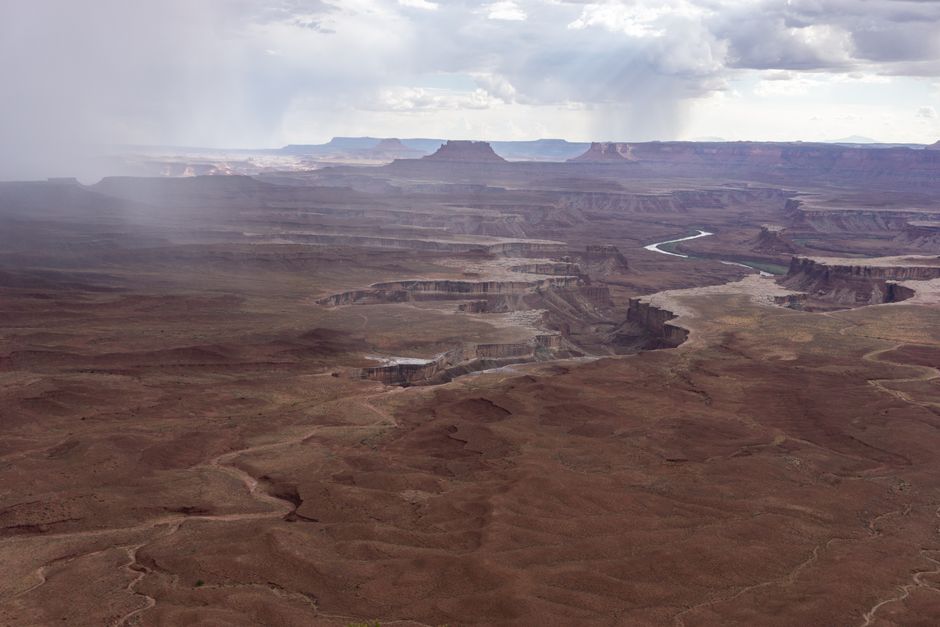 Outstanding Canyonlands National Park Airplane Tour Review: Soaring Above Utah's Most Spectacular Wilderness Review 2026 - A dramatic aerial view of Canyonlands National Park's rugged terrain under a cloudy sky.