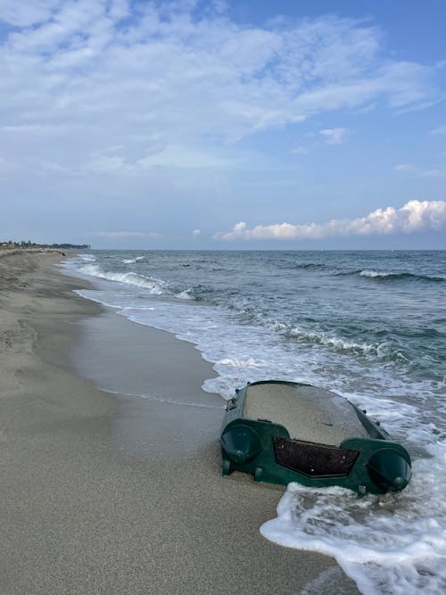 A Boat Full of Sand on the Beach 