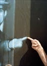 Human Hand Pointing at Man on Projector