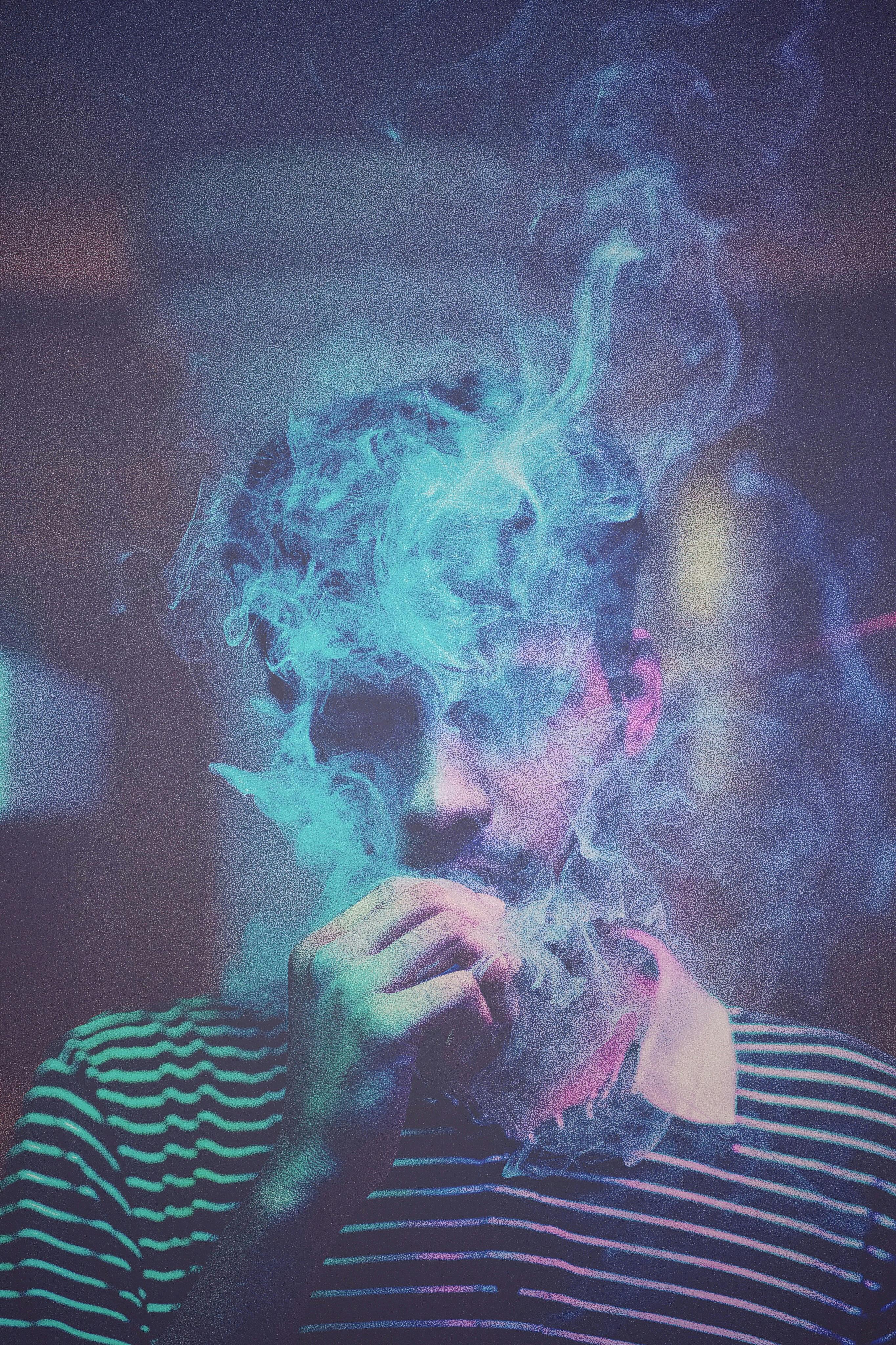 Portrait of Man Smoking Cigarette · Free Stock Photo, image size:2730x4096