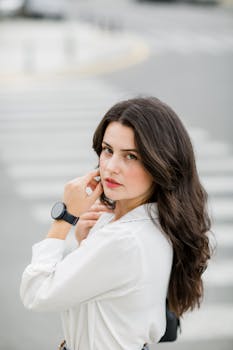 Elegant brunette woman posing in a city street of Baku, Azerbaijan.