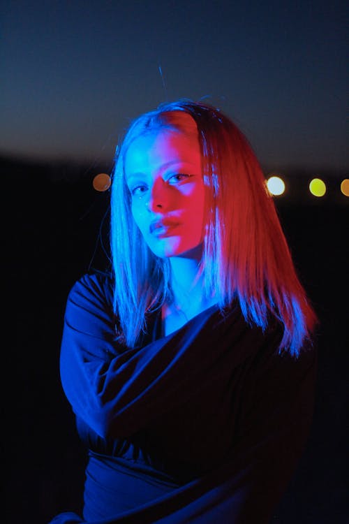 Portrait of a Blonde Woman in Red Light