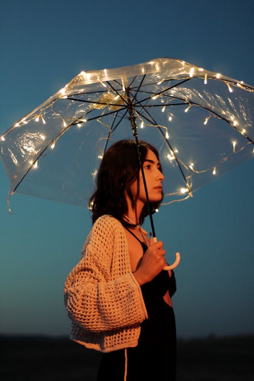 Woman Holding an Illuminated Umbrella