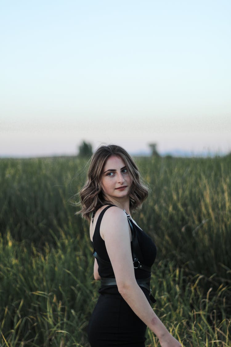 Woman Wearing Black Dress On A Field