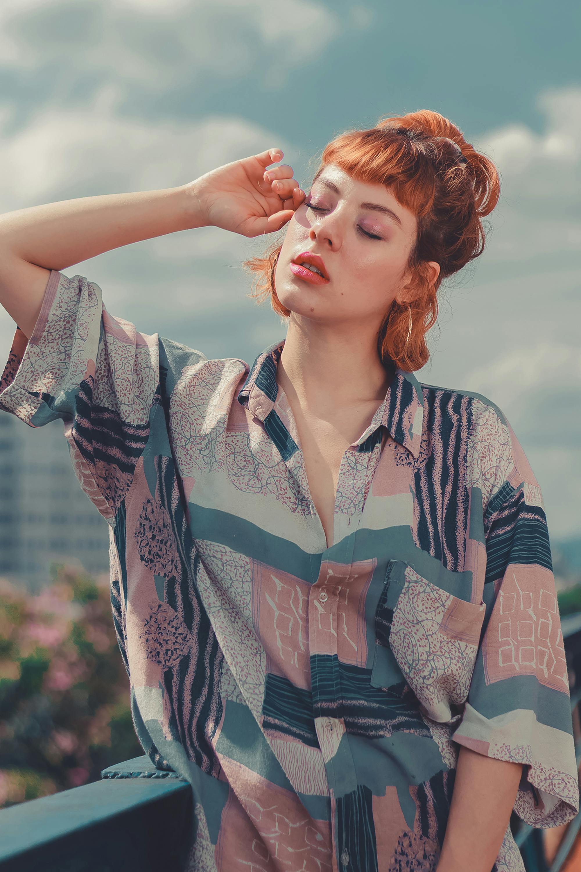 woman wearing teal pink and purple button up shirt