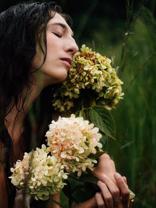 Brunette Woman with Hydrangea Flowers