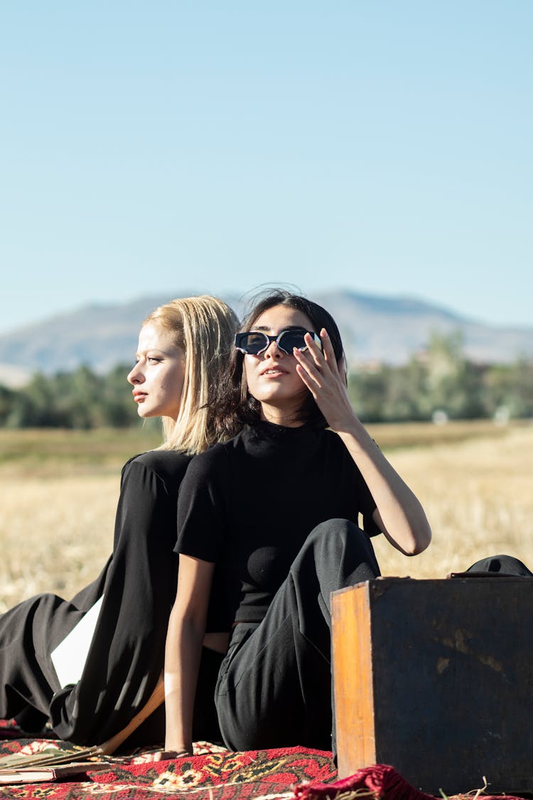 Women Sitting Together On Picnic