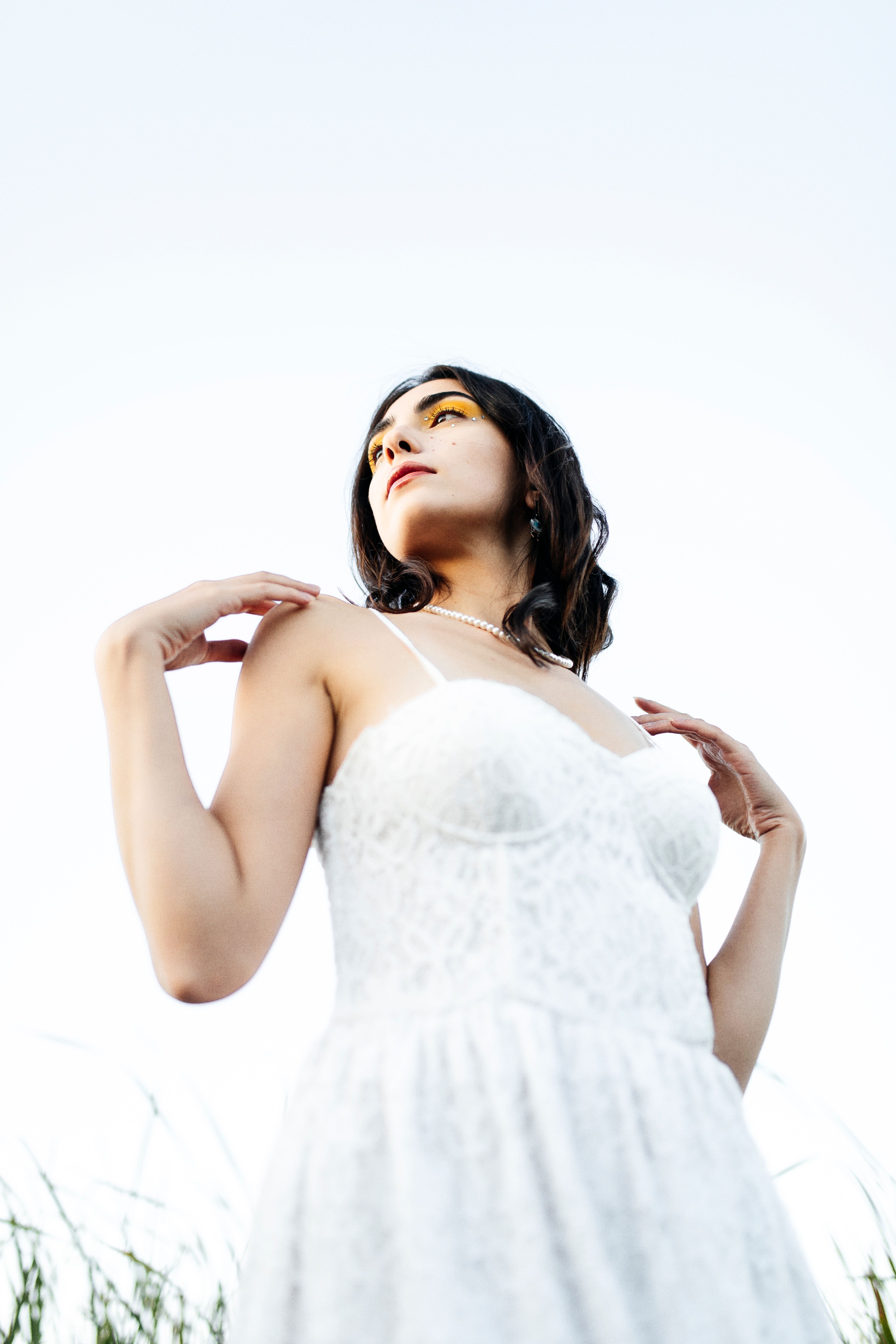 Young Woman in a White Dress Standing Outside · Free Stock Photo