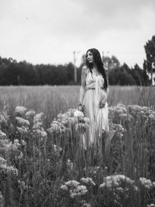 Woman in Dress on Meadow in Black and White