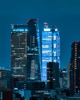 Majestic view of illuminated skyscrapers in Mexico City's skyline at night.