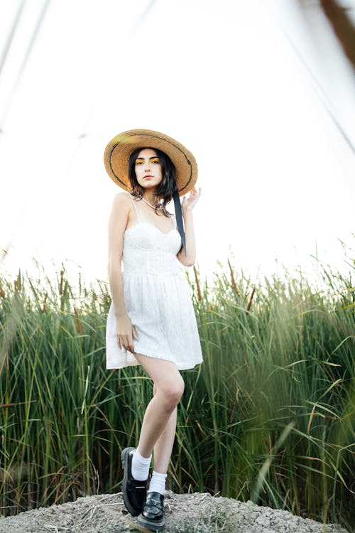 Brunette in White Dress and Hat