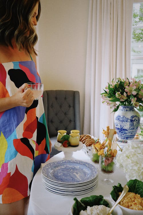 Woman by Elegant Table with Breakfast