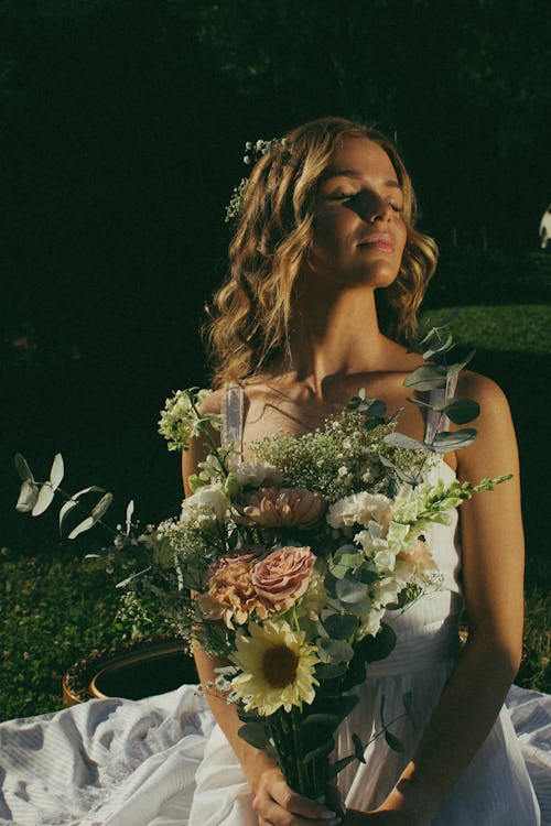 Bride Holding a Bouquet of Flowers
