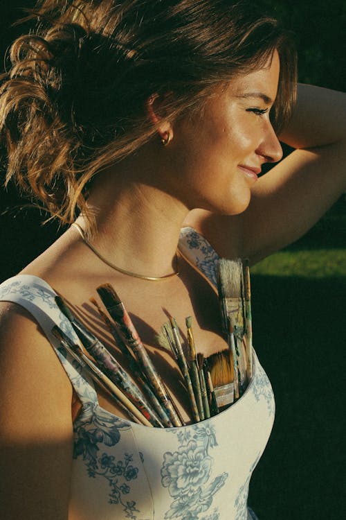 Smiling Woman with Paintbrushes 